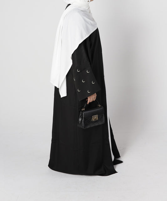 Side profile of Crescent abaya in black with sleeve moon embroidery – Qalbi modest wear