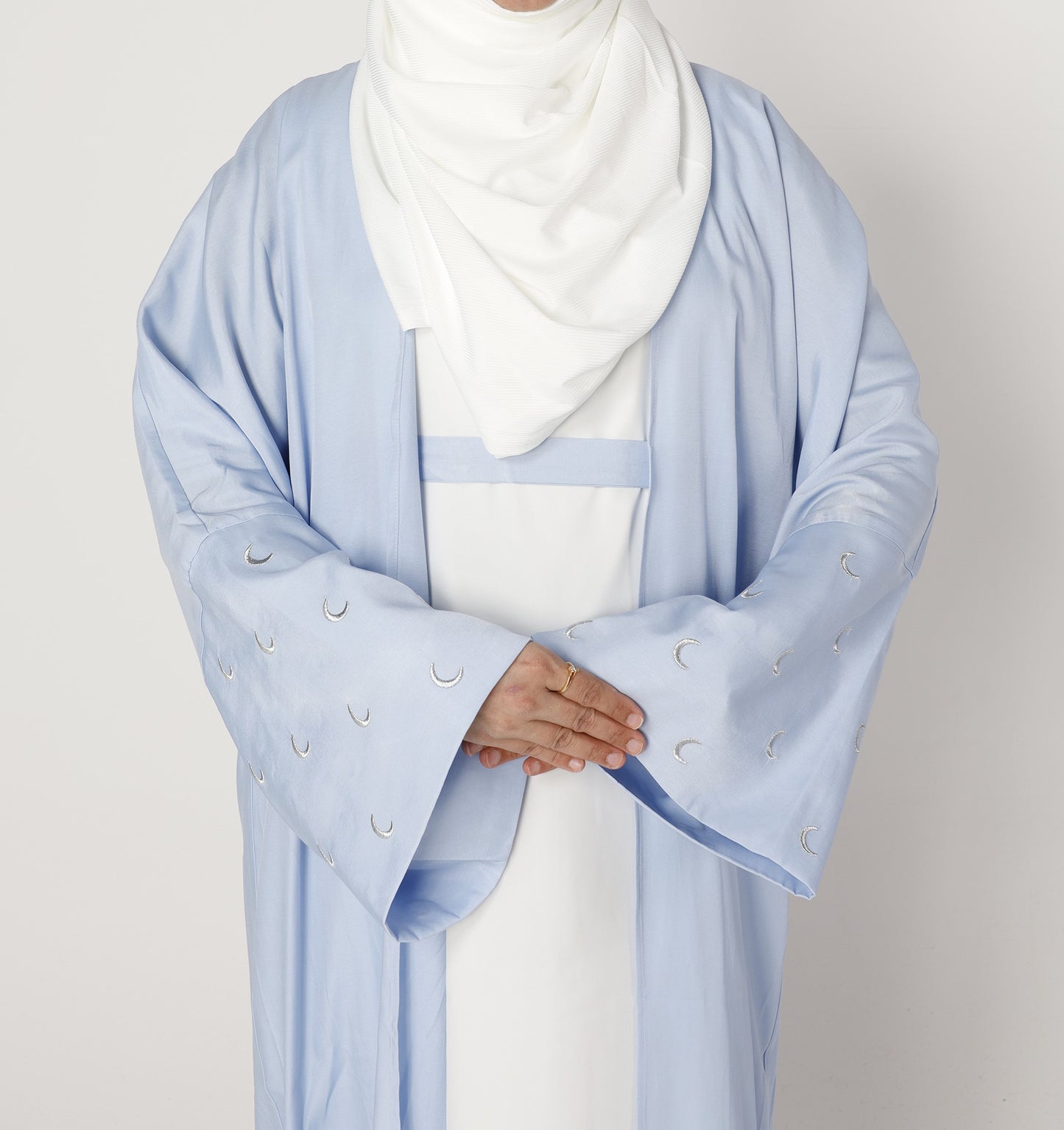 Close-up moon embroidery detail on blue pearl Crescent abaya – Qalbi modest fashion