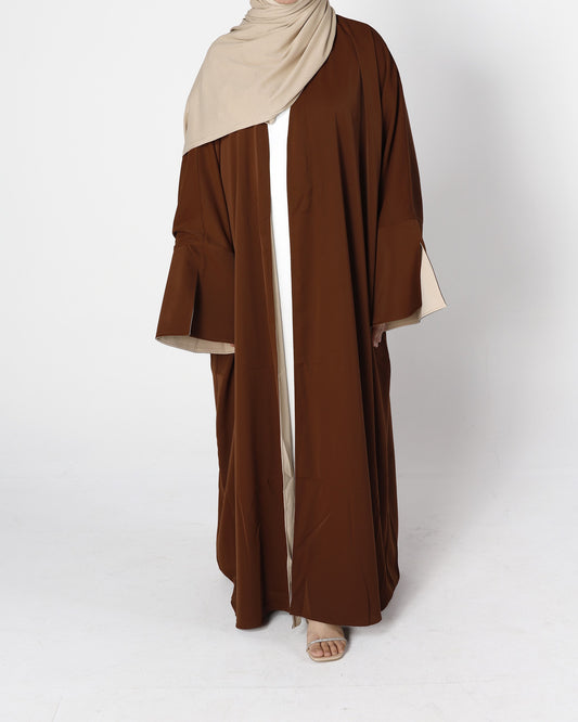 Front view of Riwaaya double-sided abaya in mocha desert sand – Qalbi modest clothing