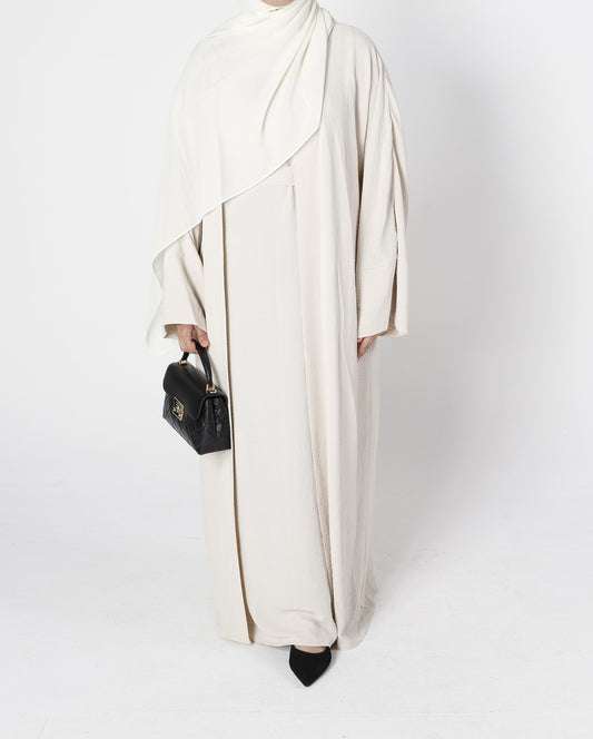 Front view of ivory cream crinkle abaya 3-piece set with belt – Qalbi modest clothing