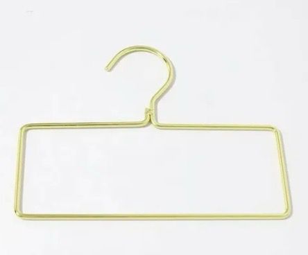 Gold rectangular hanger designed to keep fabrics smooth and wrinkle-free