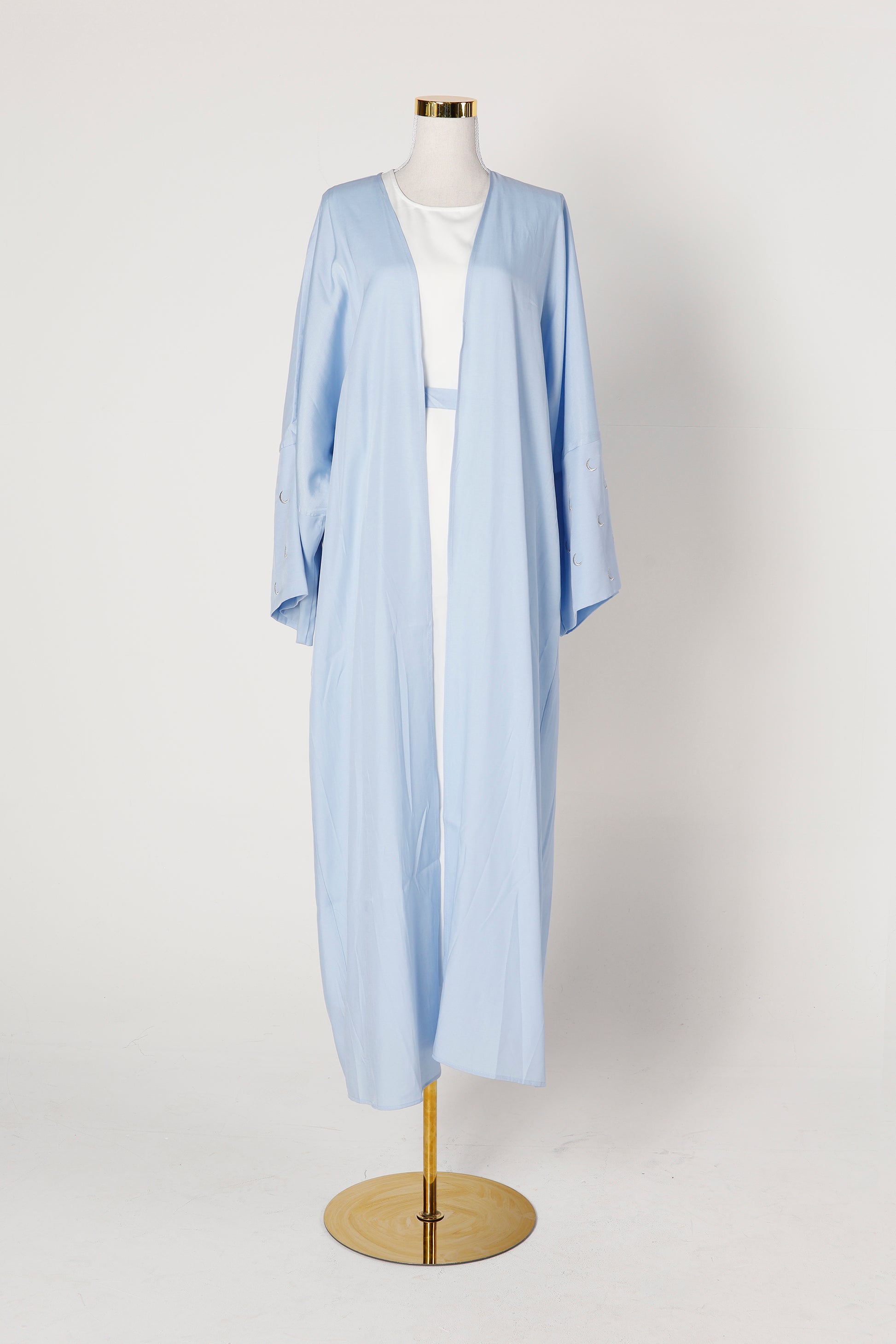 Blue pearl Crescent abaya with moon embroidery displayed on mannequin – Qalbi