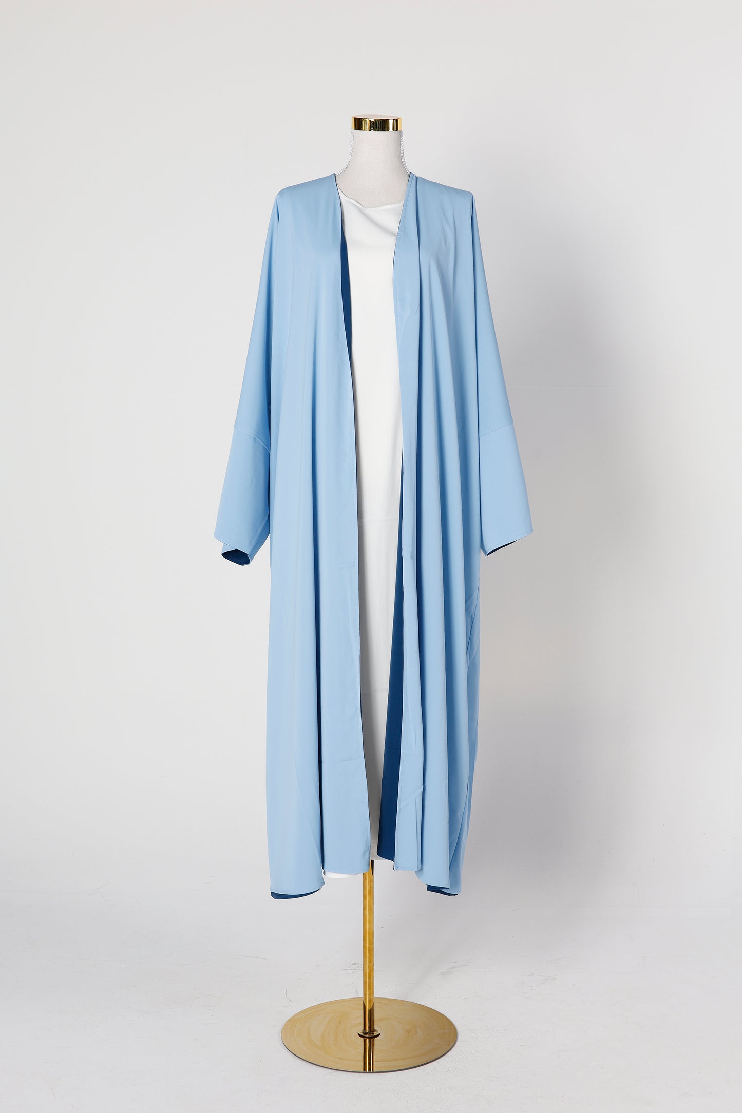 Riwaaya double-sided abaya in blue  haze displayed on mannequin – Qalbi