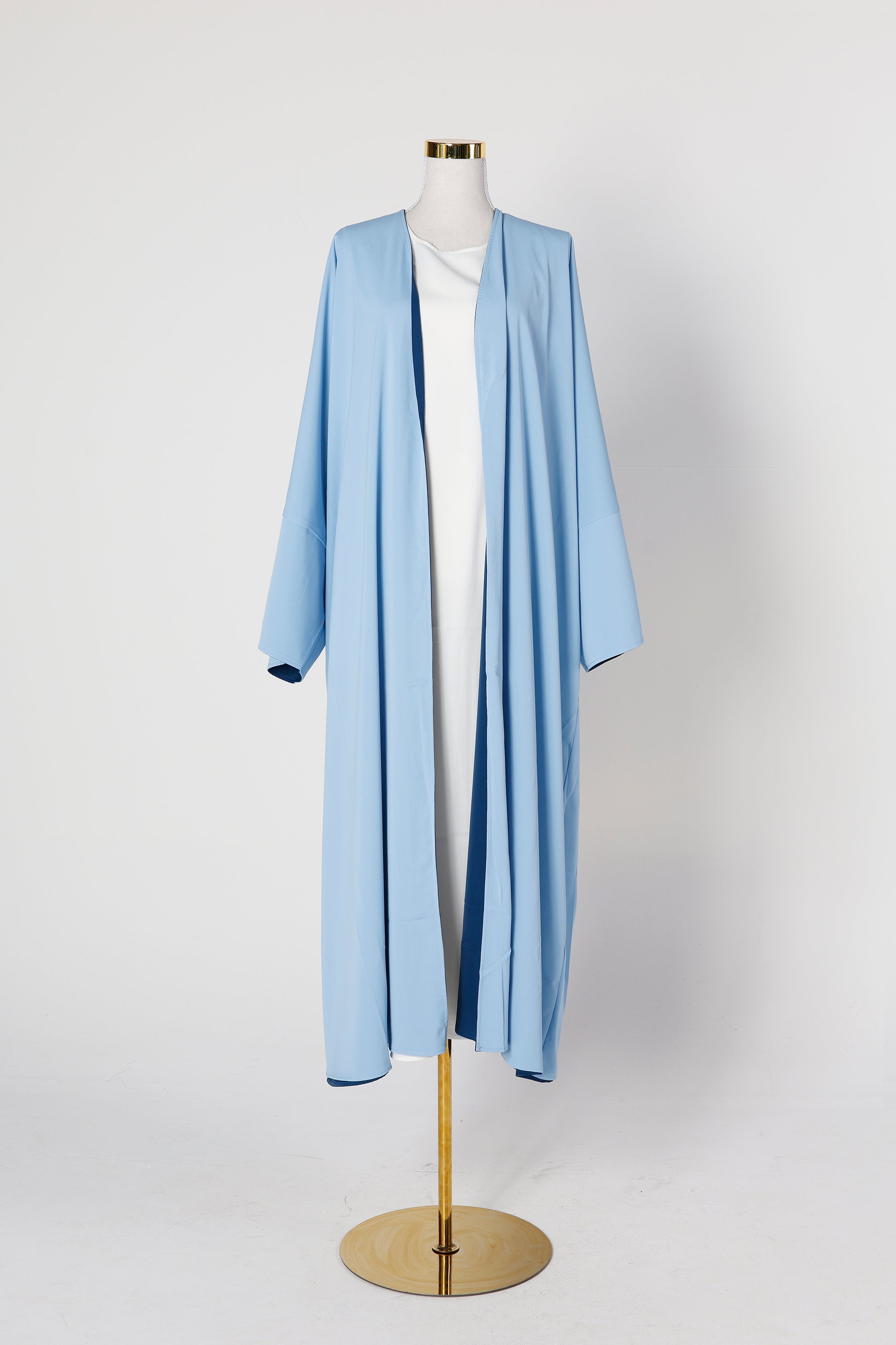Riwaaya double-sided abaya in blue  haze displayed on mannequin – Qalbi