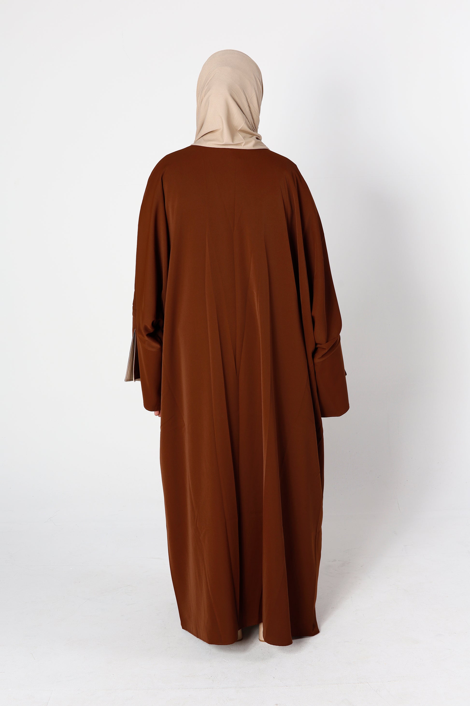 Back view of mocha desert sand Riwaaya abaya with flowing modest cut – Qalbi