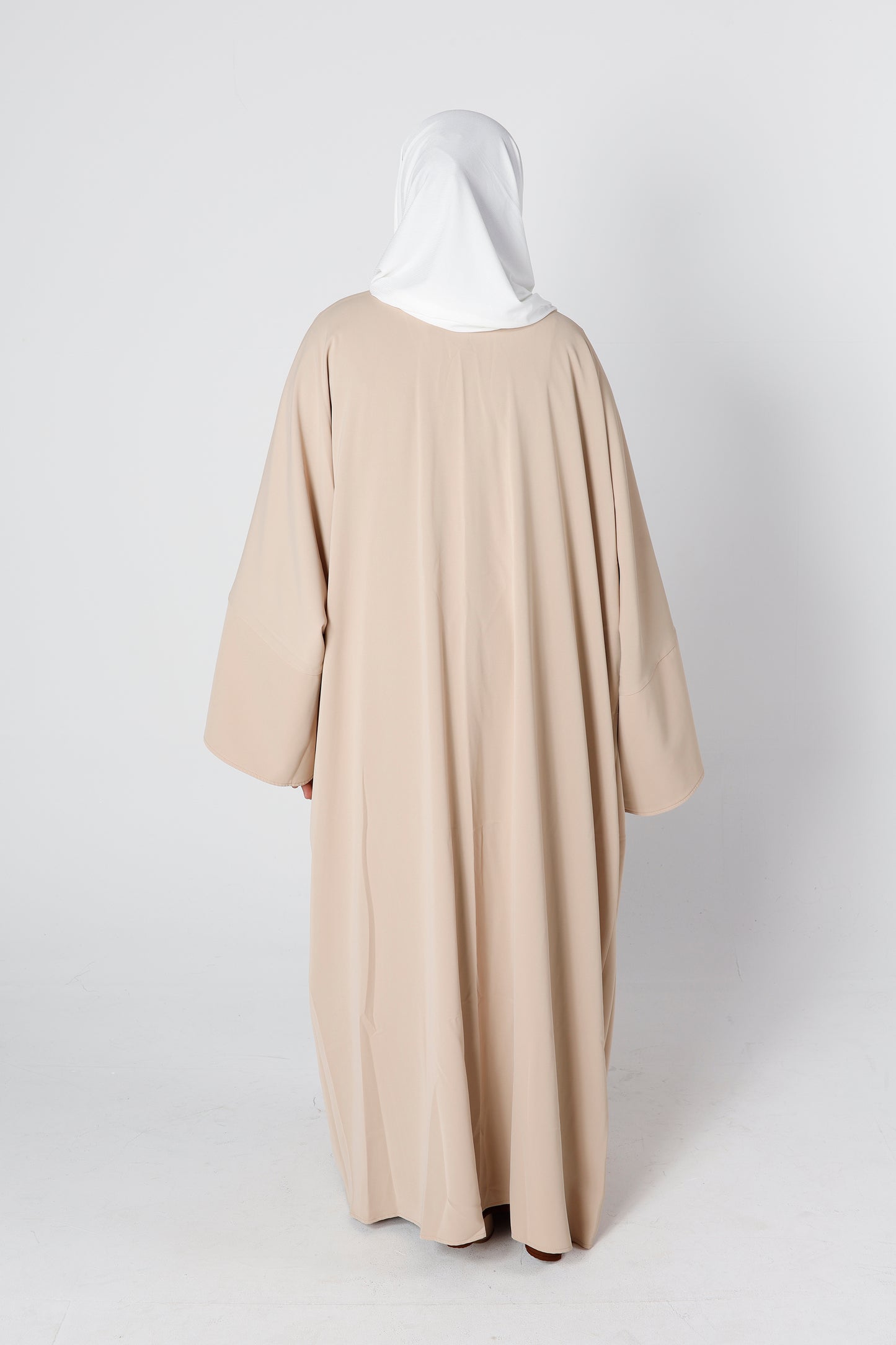 Back view of desert sand Riwaaya abaya with flowing modest cut – Qalbi
