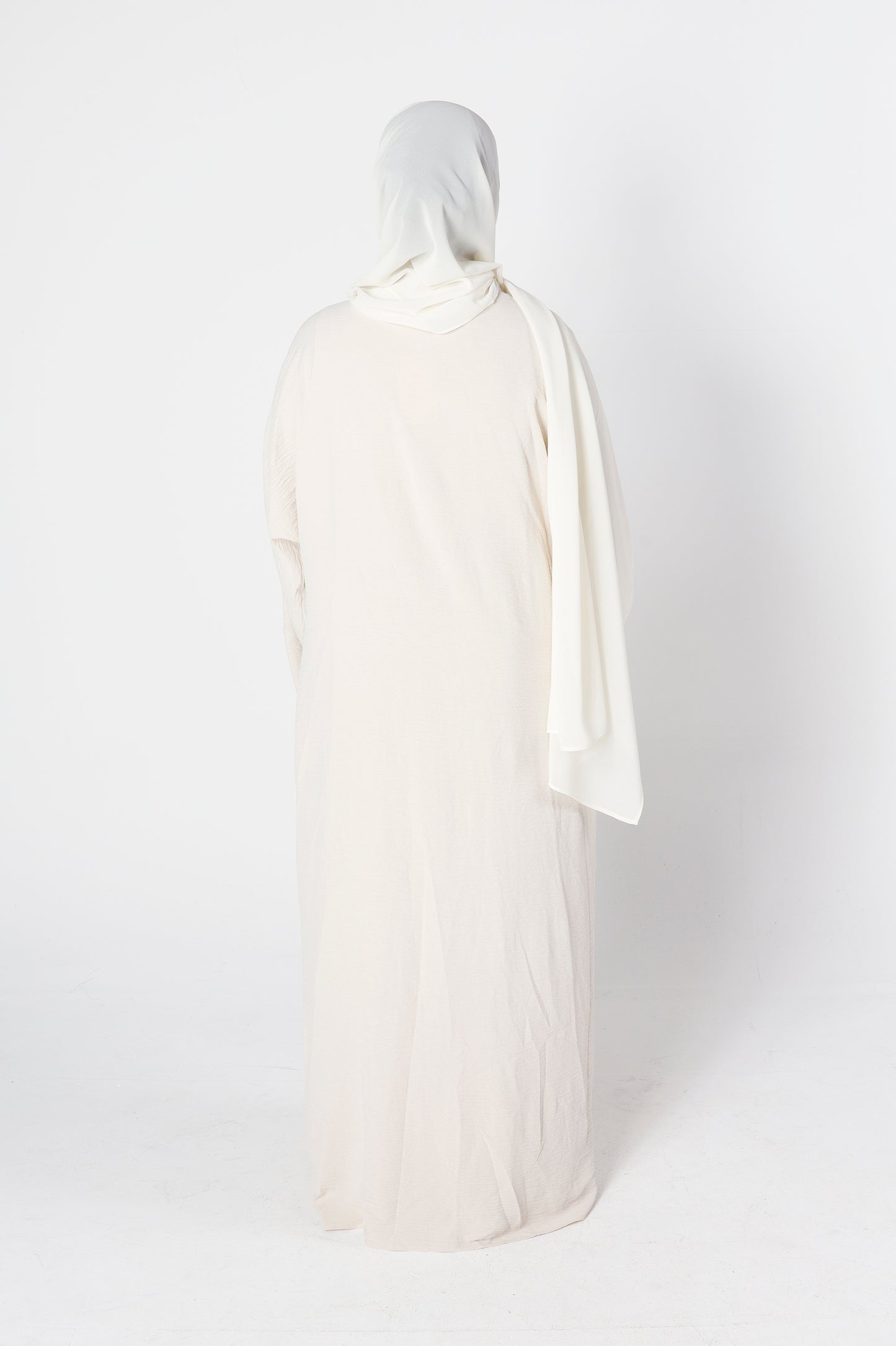 Back view of ivory cream crinkle abaya set with inner dress – Qalbi modest fashion