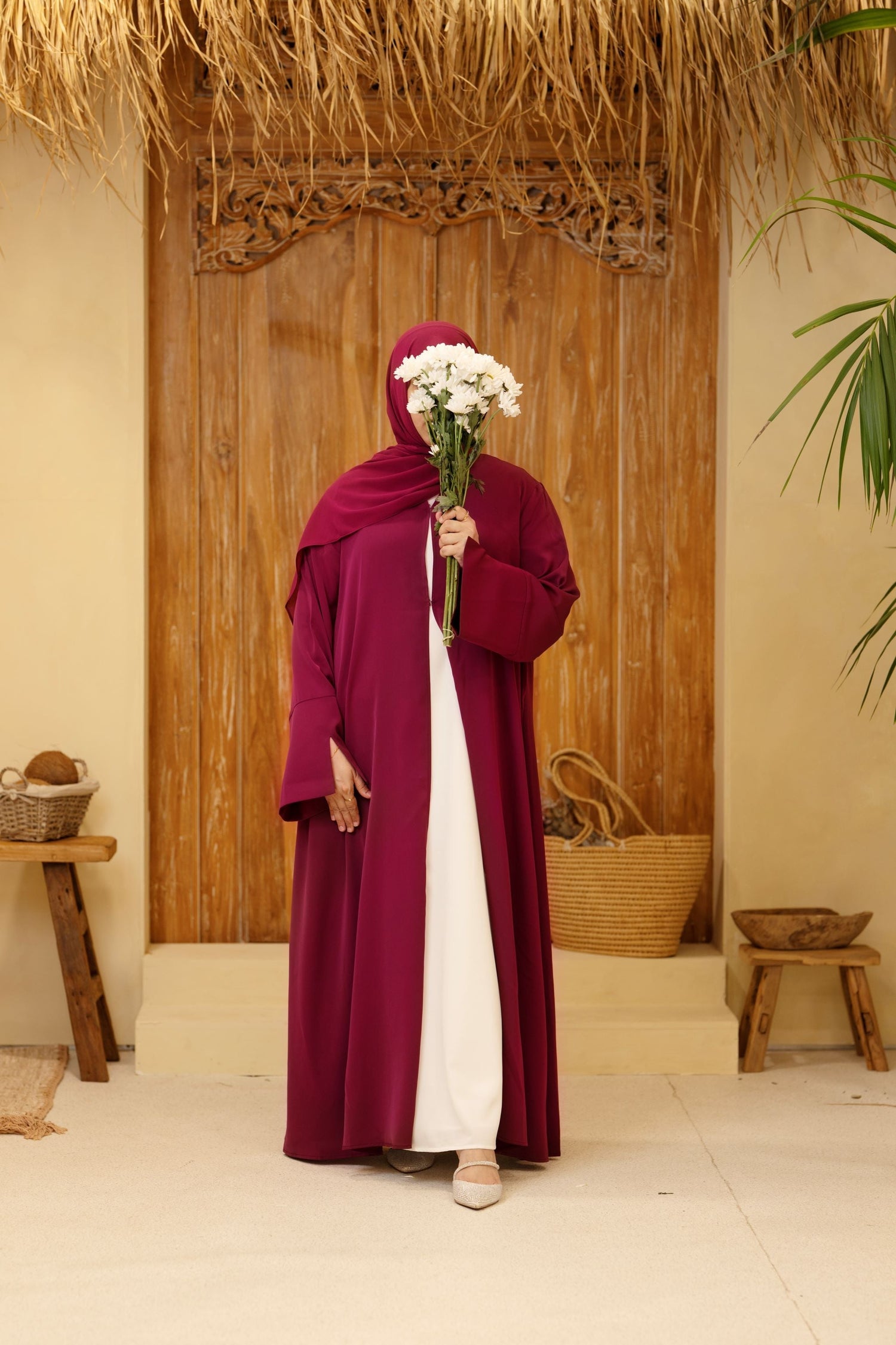 Front view of elegant burgundy abaya for women – modest and stylish everyday wear