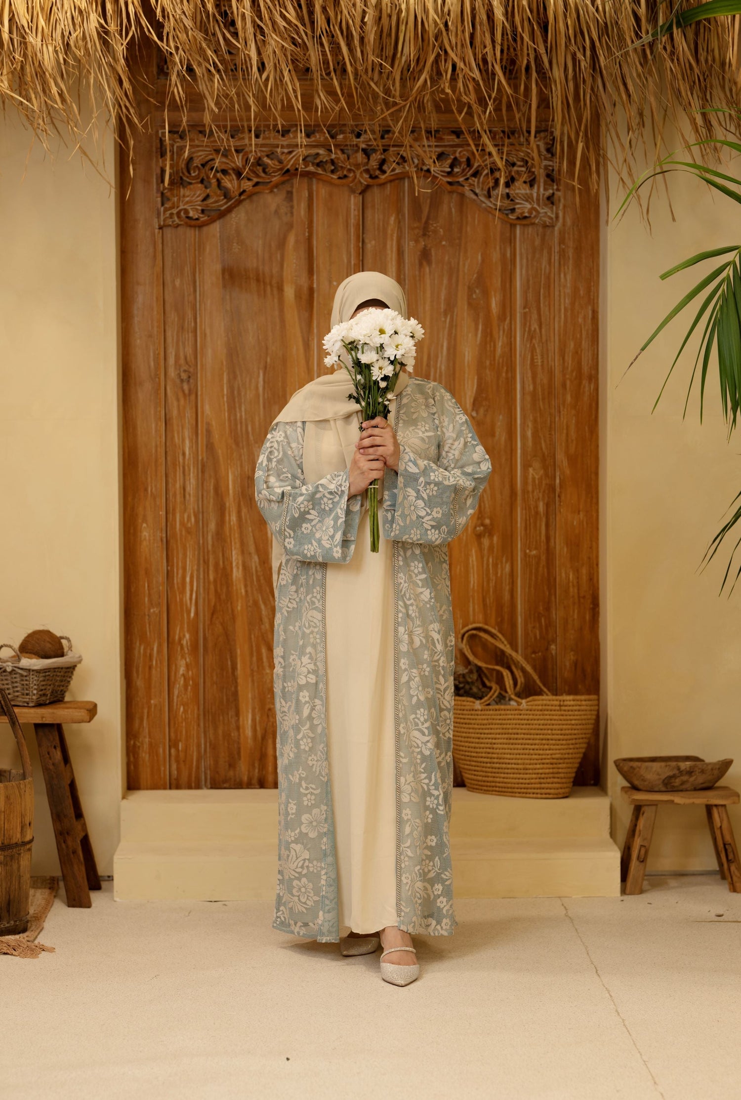 Elegant front view of a modest firdaus abaya for women, showcasing its stylish and flowing design.