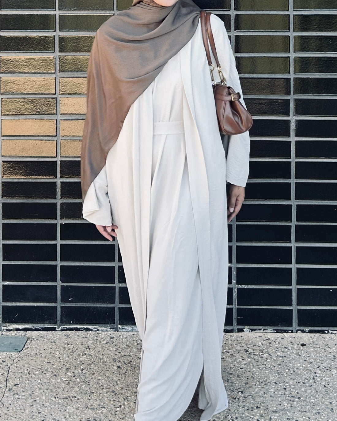 Woman wearing beige abaya in Australia - modest fashion by Qalbi