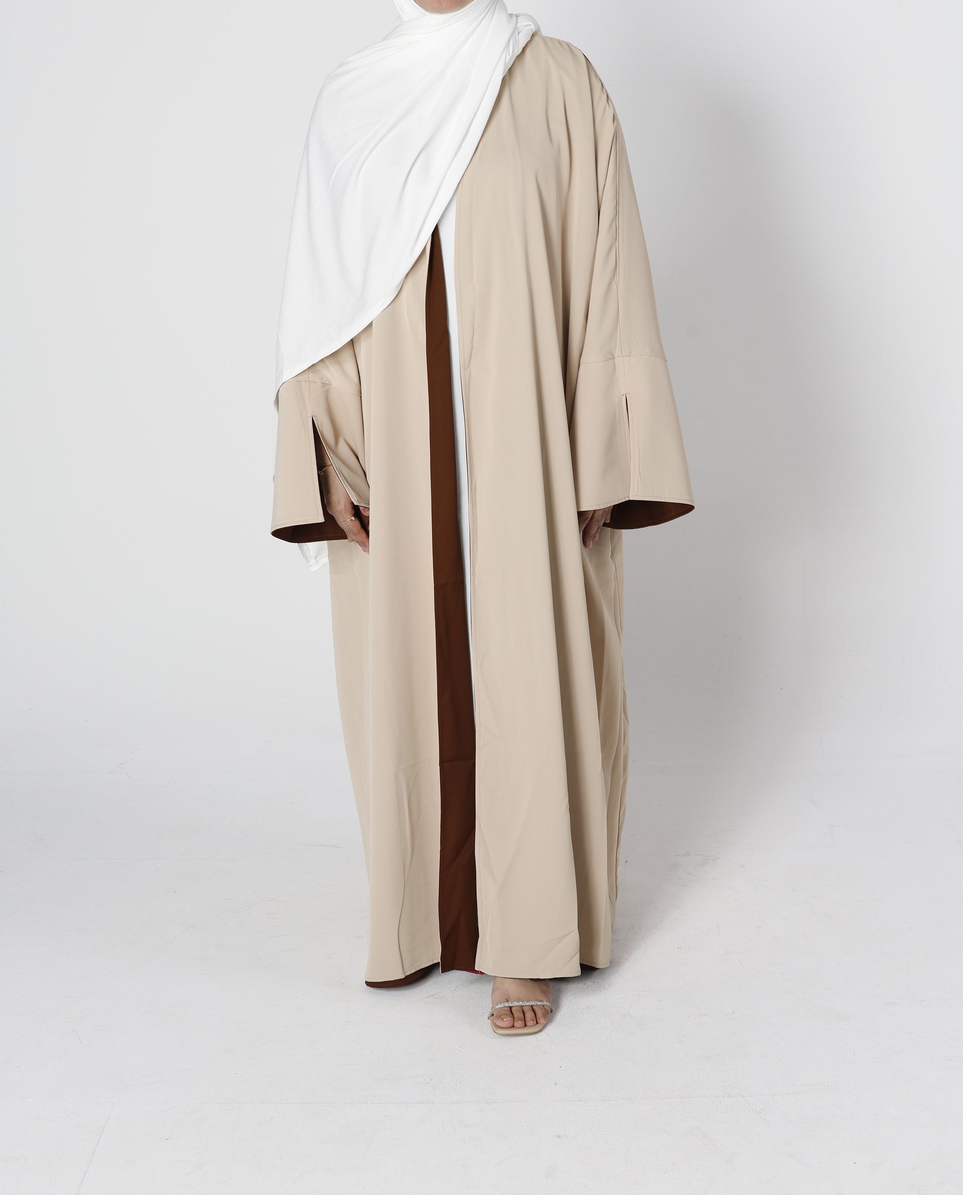 Front view of Riwaaya double-sided abaya desert sand – Qalbi modest clothing