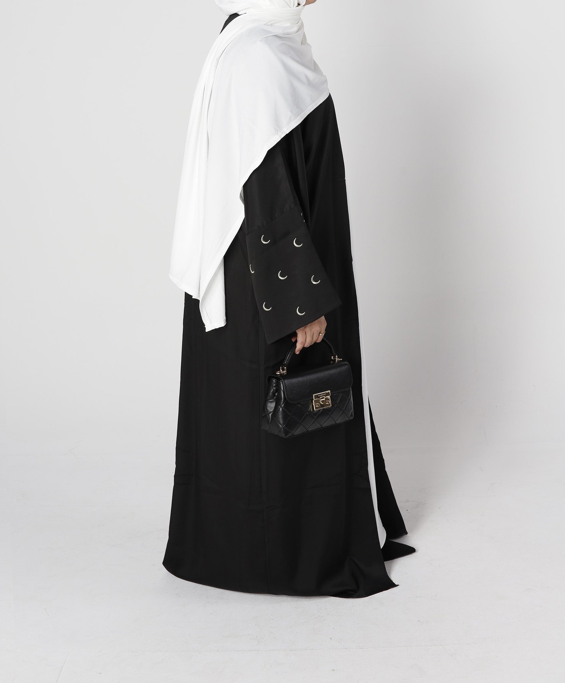 Side profile of Crescent abaya in black with sleeve moon embroidery – Qalbi modest wear