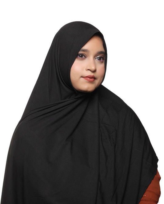 Close-up fabric detail of classic black textured jersey hijab stretch texture – Qalbi modest fashion