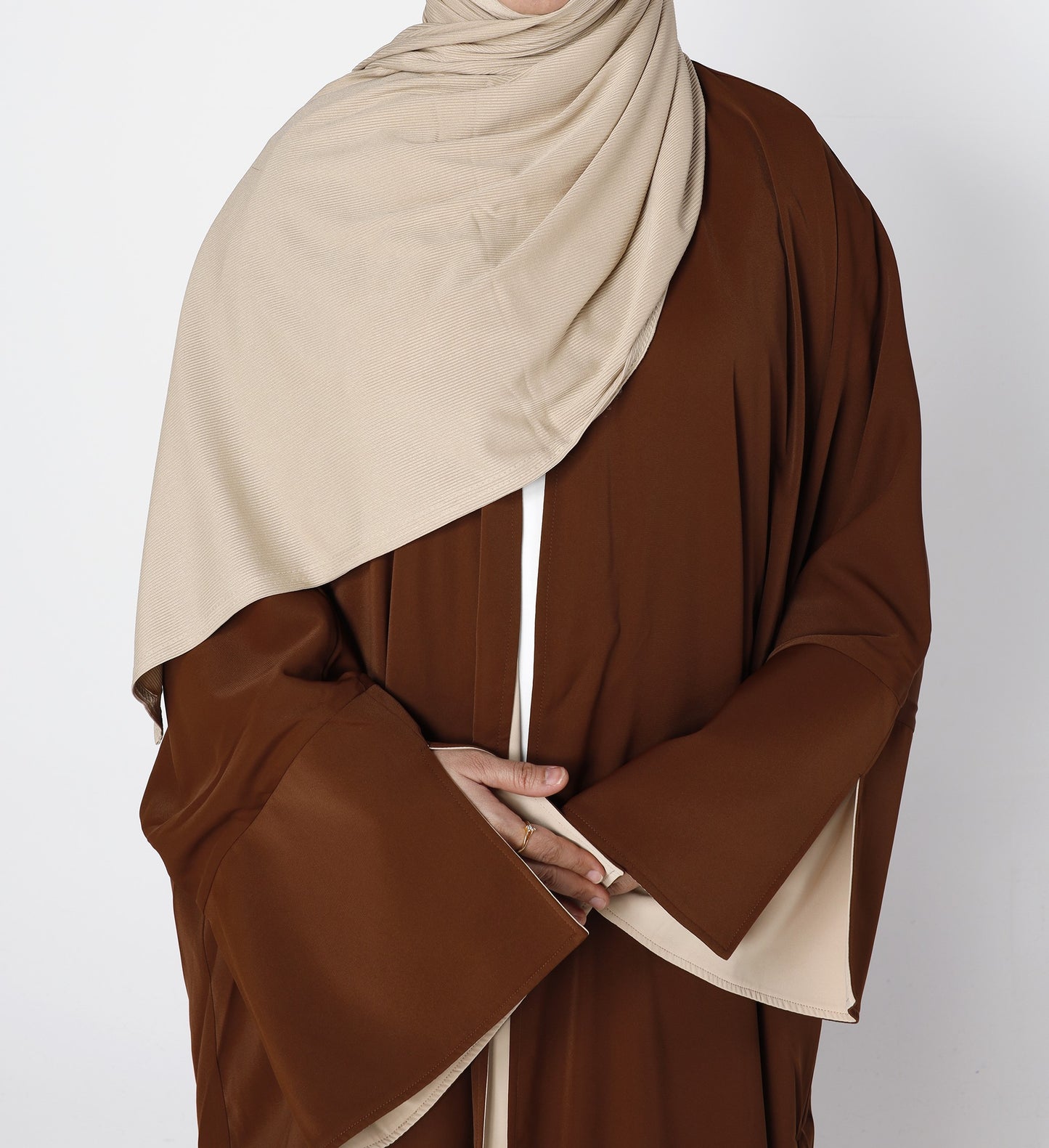 Close-up fabric texture of Riwaaya abaya in mocha desert sand – Qalbi