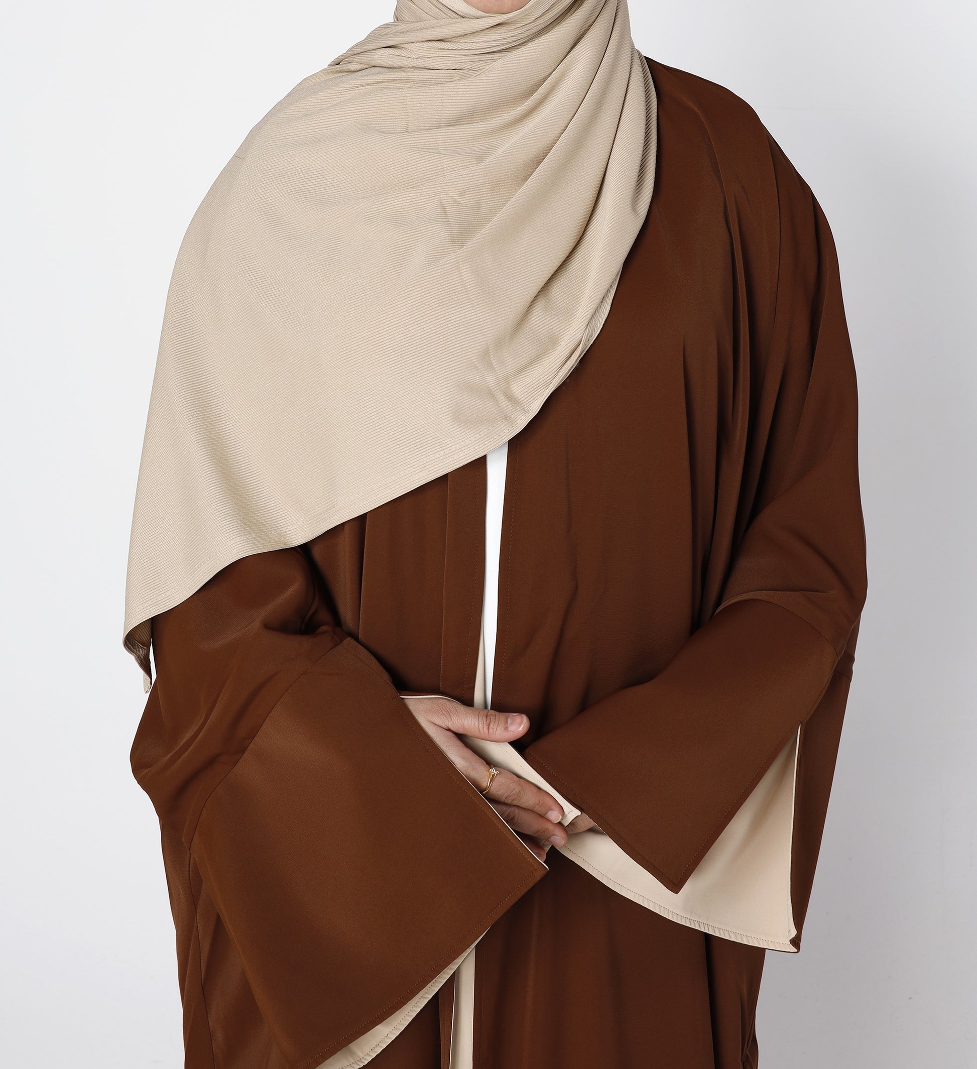 Close-up fabric texture of Riwaaya abaya in mocha desert sand – Qalbi