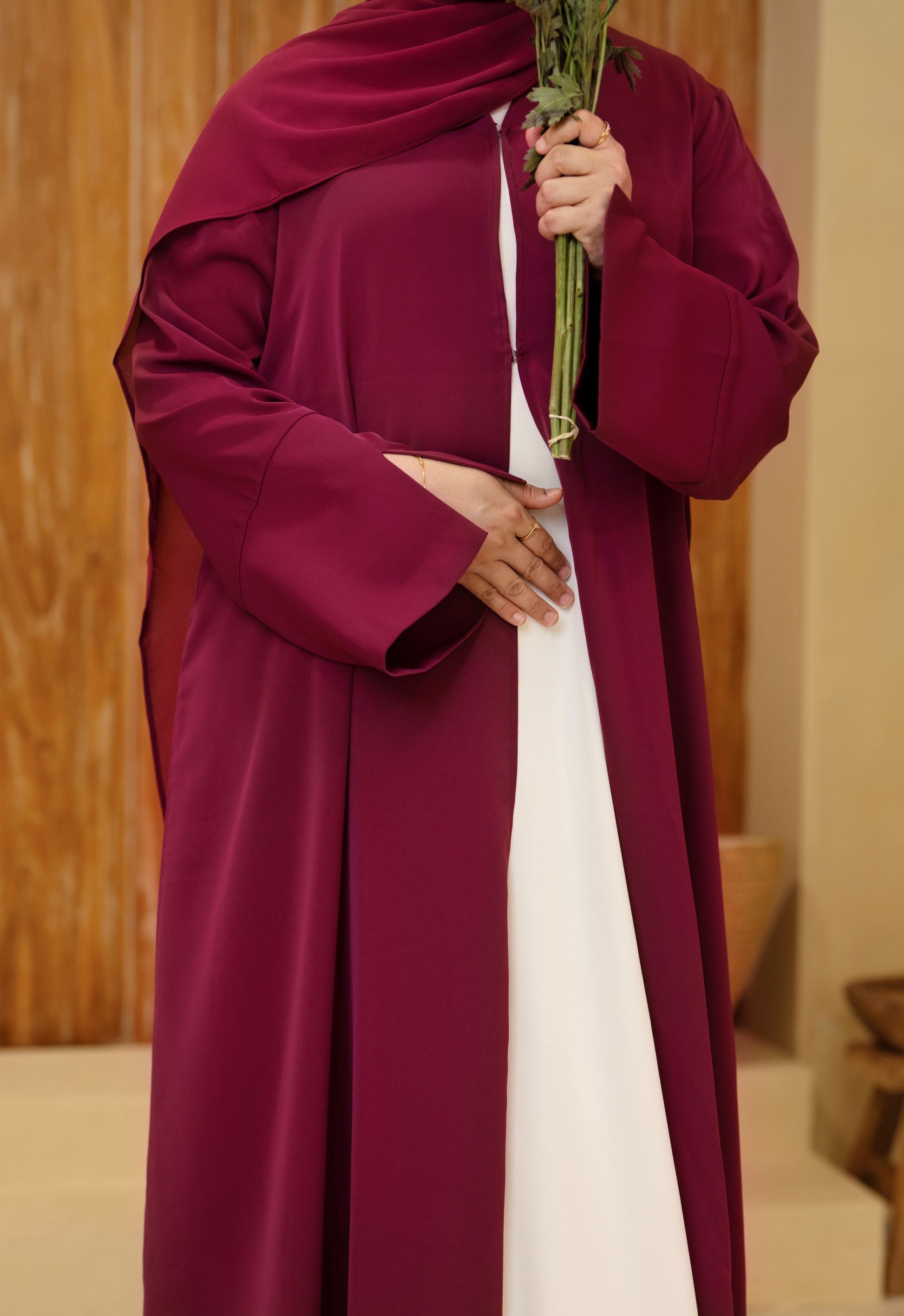 Detailed front view of burgundy classic abaya, highlighting the rich fabric and modest silhouette — Classic Abaya Burgundy Bliss.