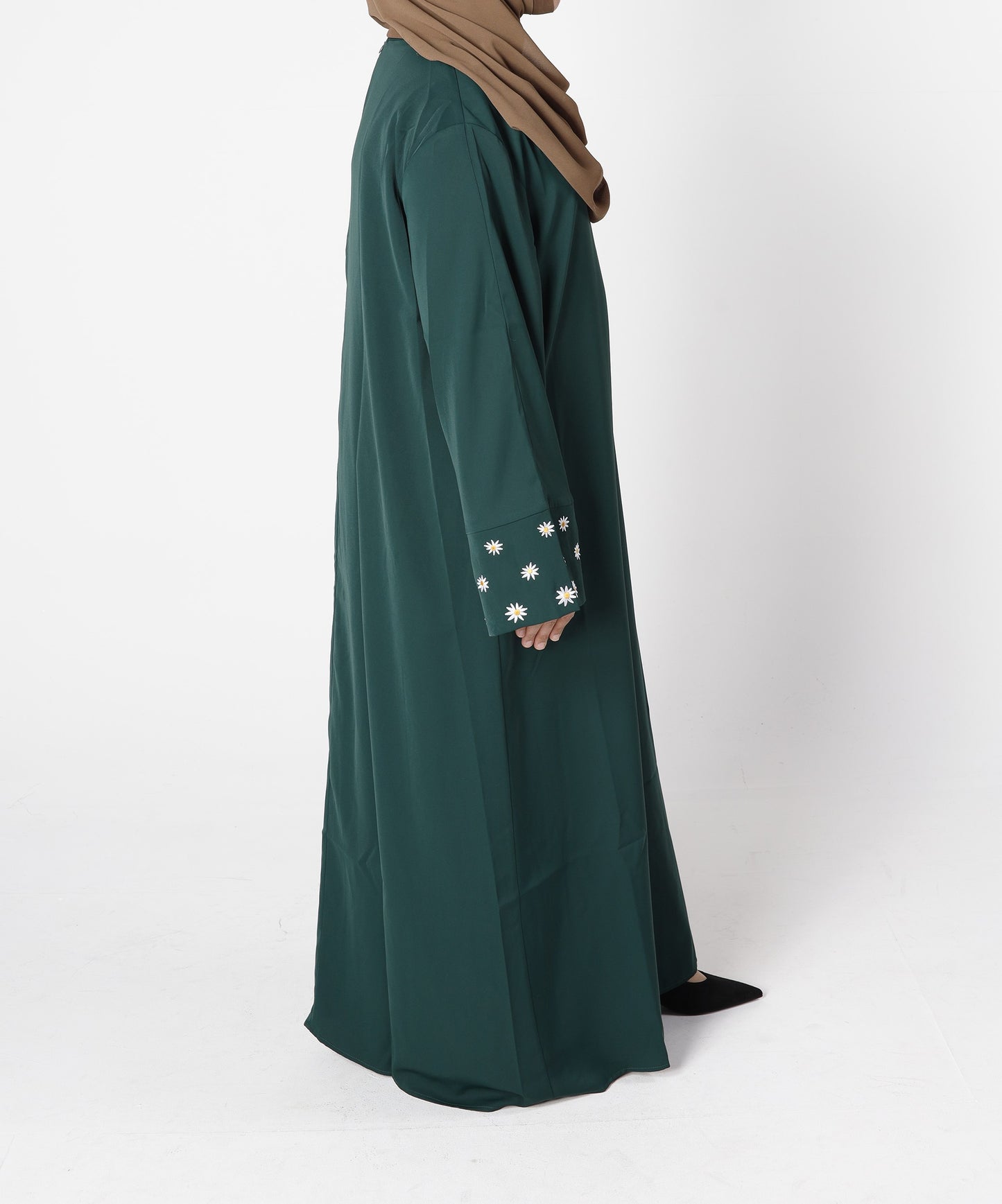 Side profile of Zahra abaya in emerald green flowing design – Qalbi
