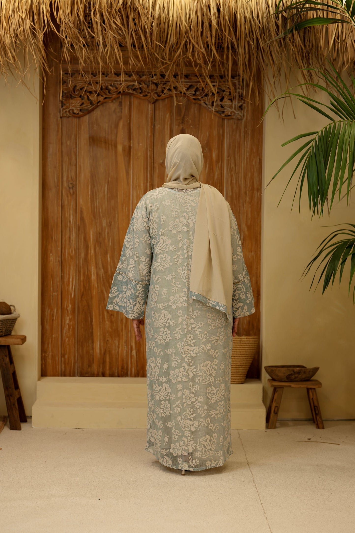 Firdaus Abaya Emerald Gold side angle with flowing silhouette