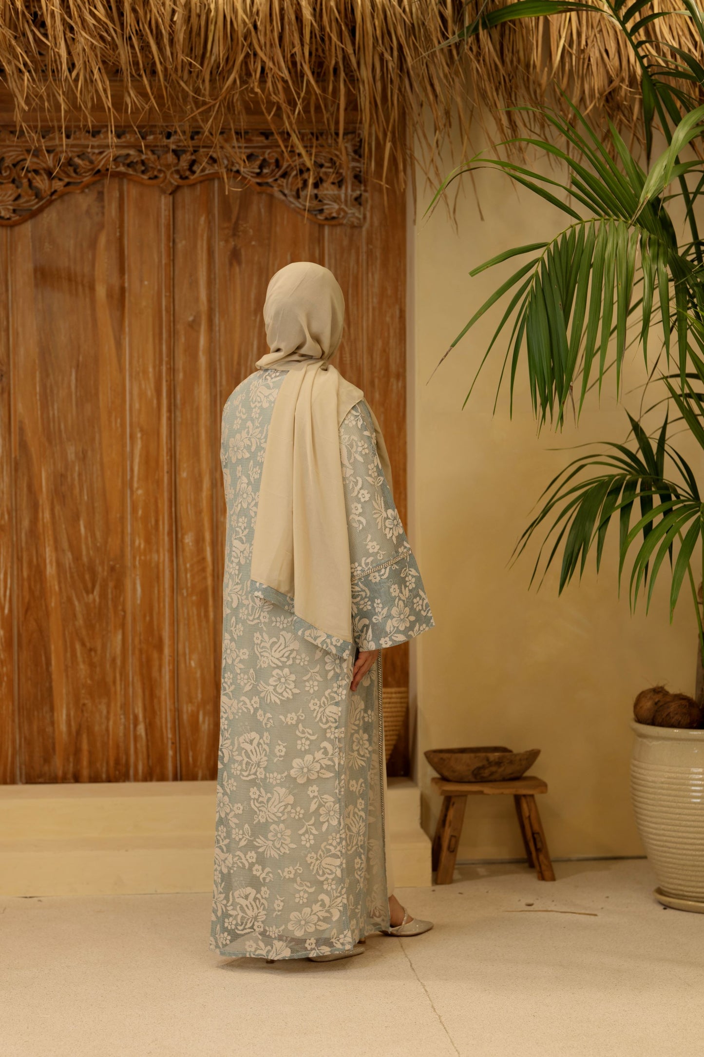Back view showing gold embroidery and modest fall