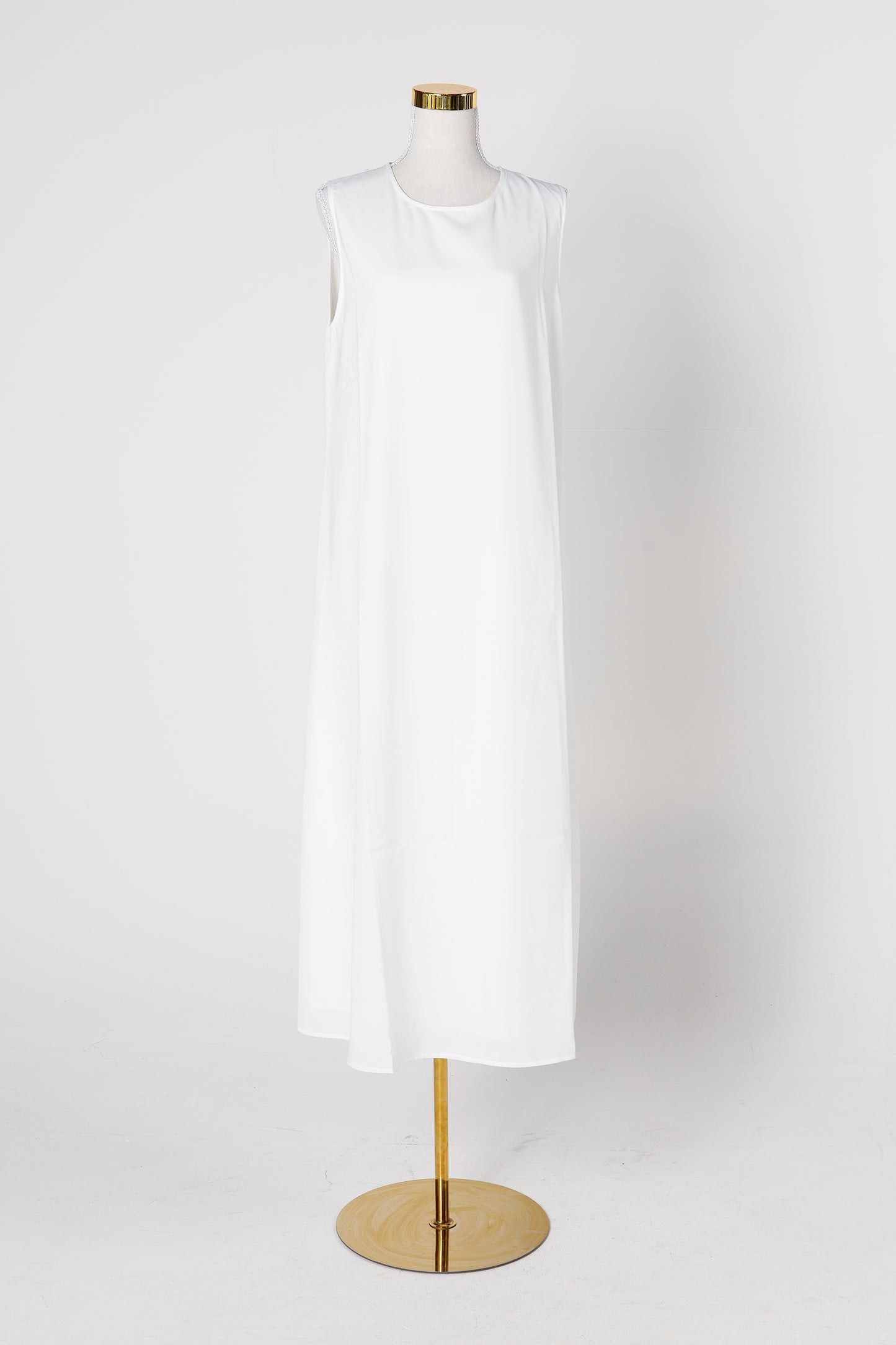 White under abaya dress displayed on mannequin versatile layering – Qalbi