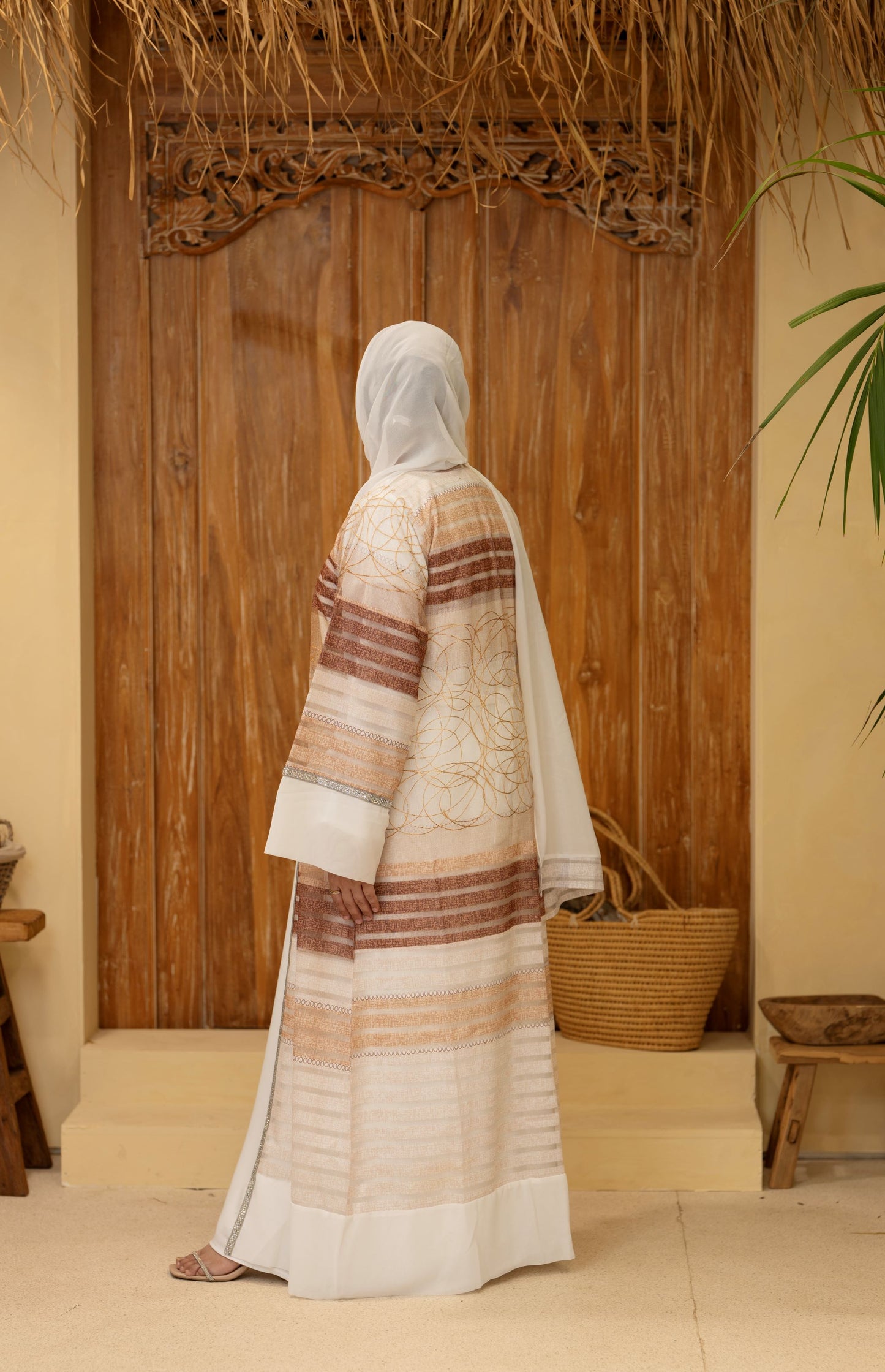 Front standing pose with soft shimmer and modest silhouette