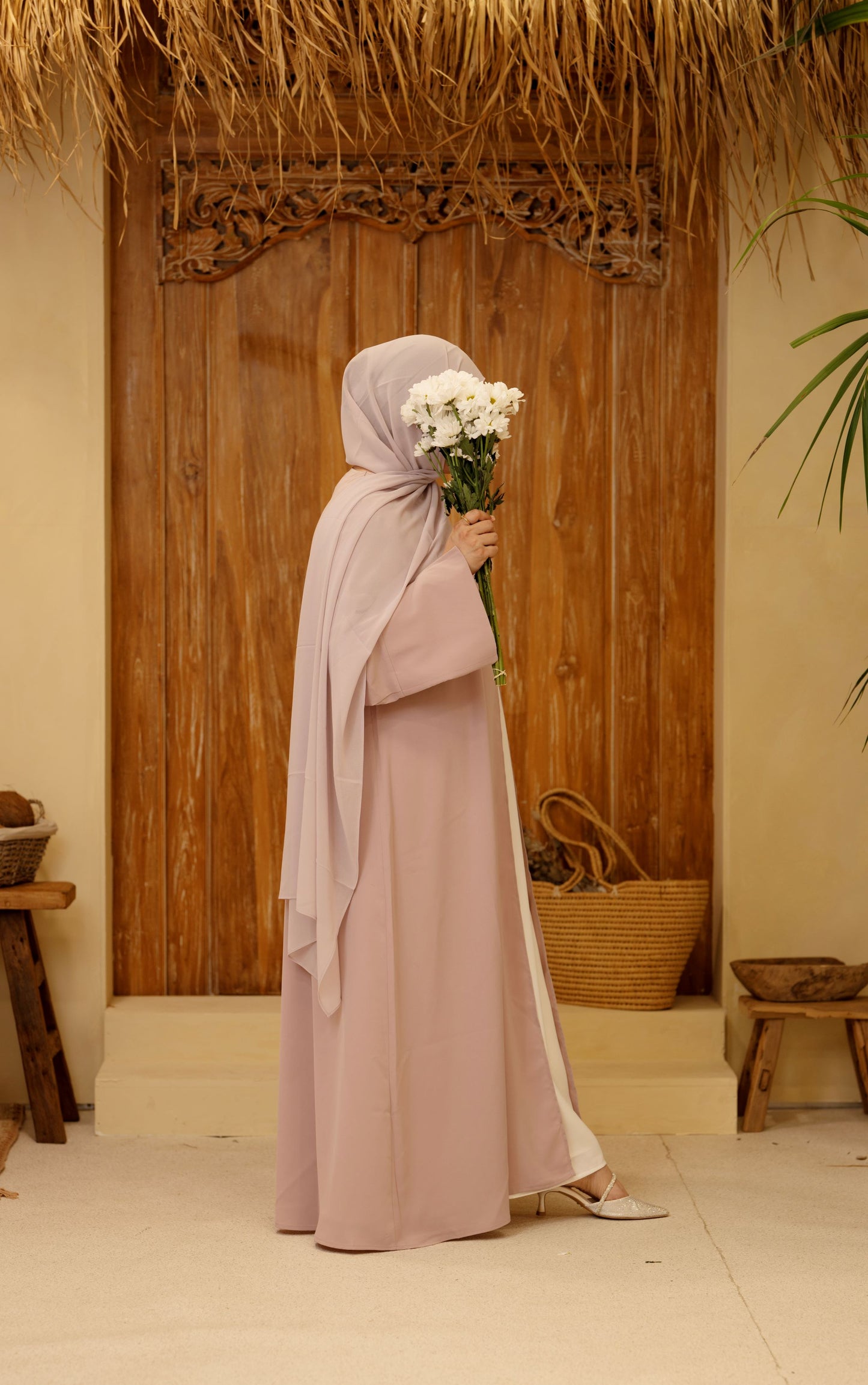 Side view of the rose mist Qalbi Classic Abaya, highlighting the flowy, breathable silhouette and elegant drape.
