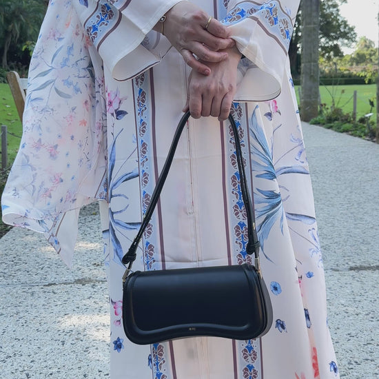 Qalbi Botanical bloom floral abaya in peach cream flowy silhoutte
