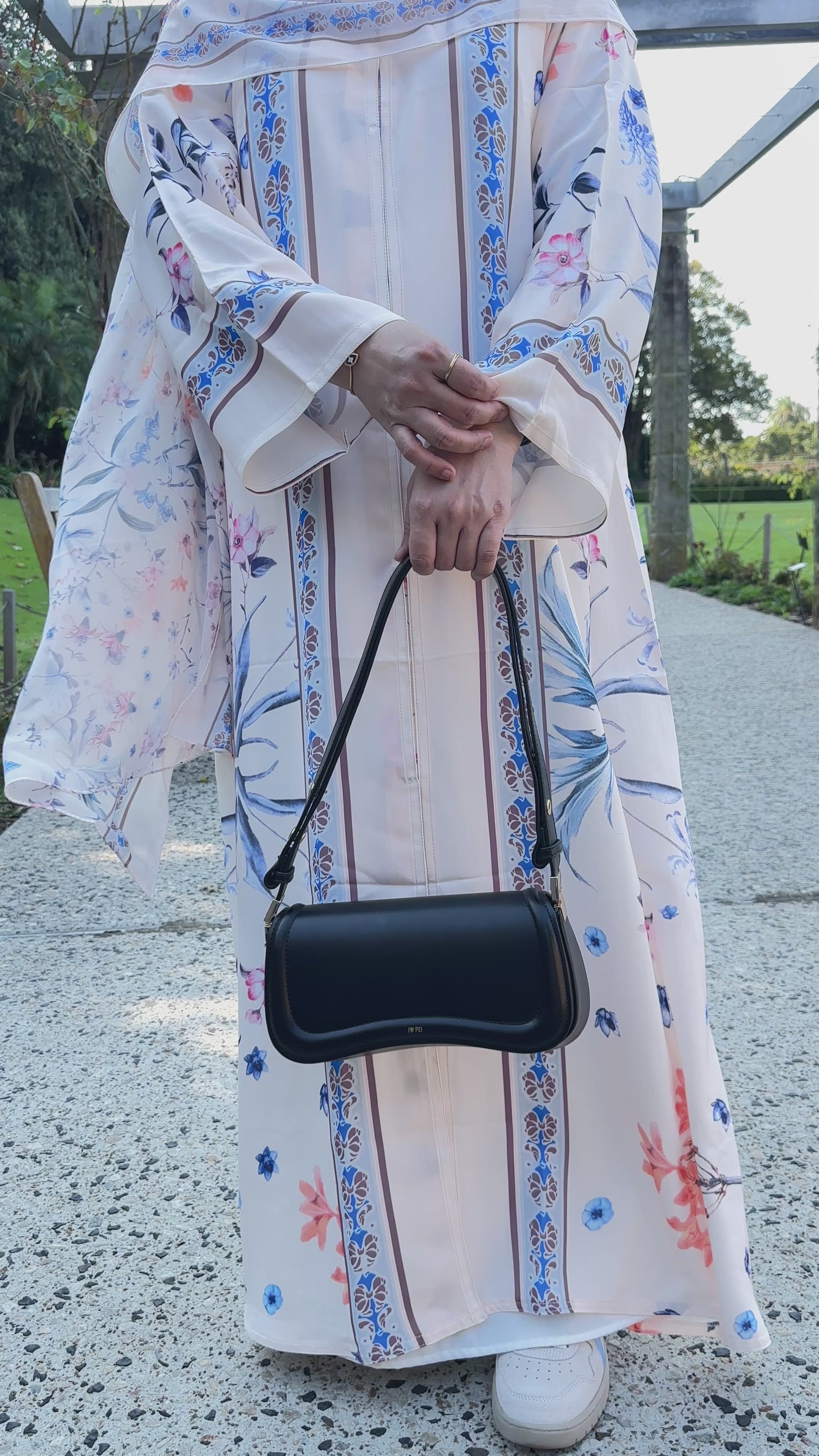 Qalbi Botanical bloom floral abaya in peach cream flowy silhoutte