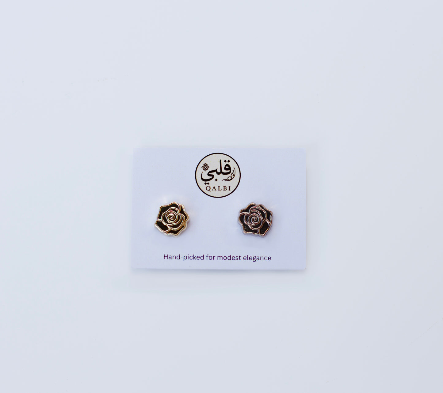 Rose-shaped Chrome Hijab Magnets on a QALBI branded card with a white background