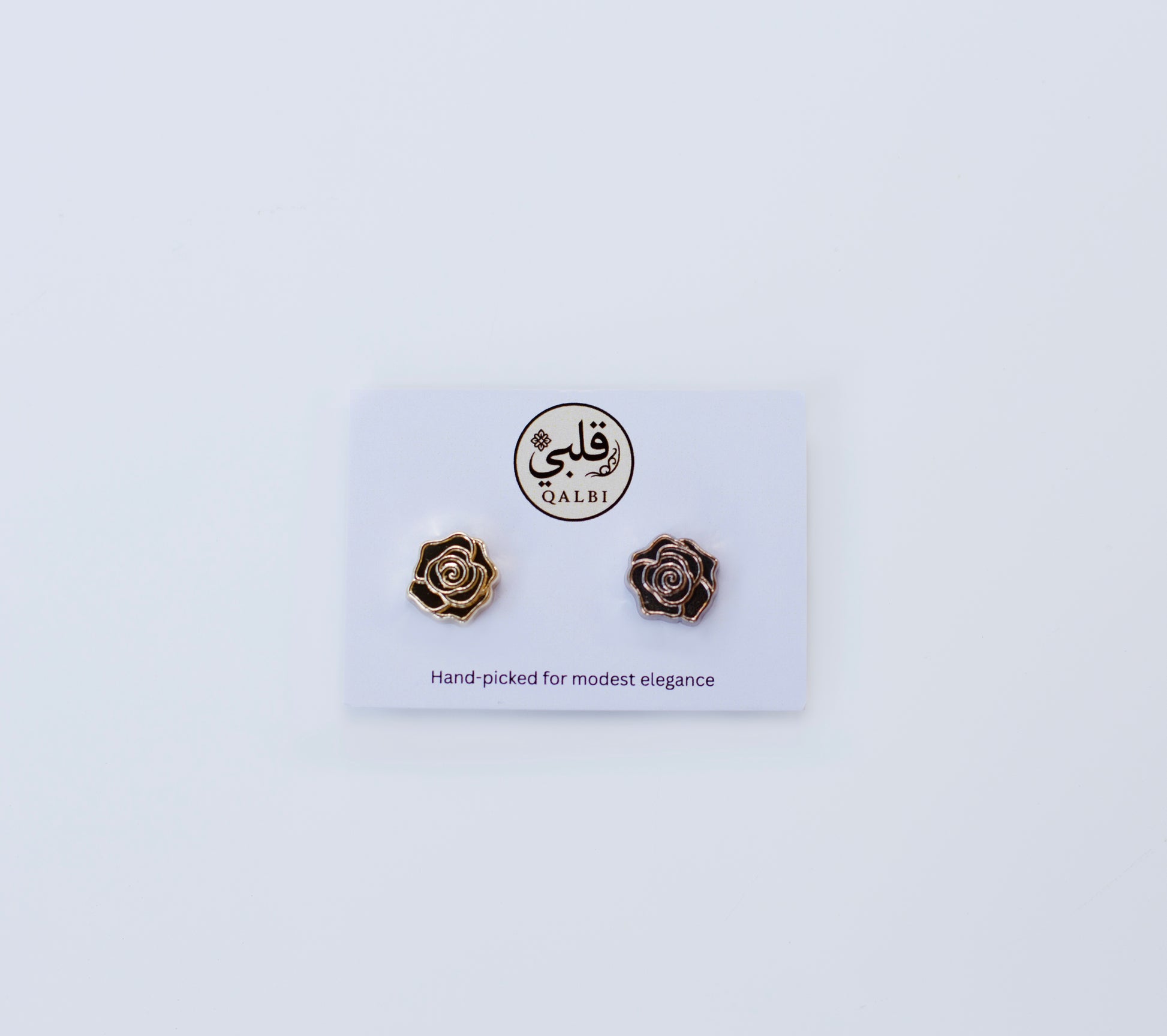 Rose-shaped Chrome Hijab Magnets on a QALBI branded card with a white background